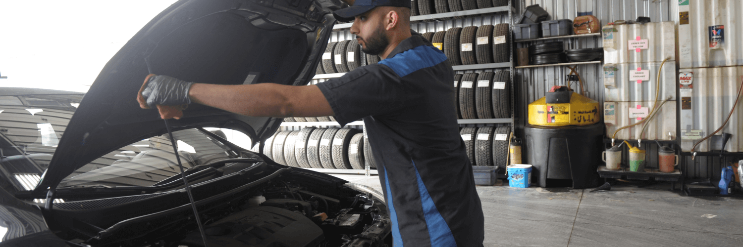 mechanic getting ready to conduct a caa approved oil change